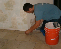 Tile Contractor setting Tile
